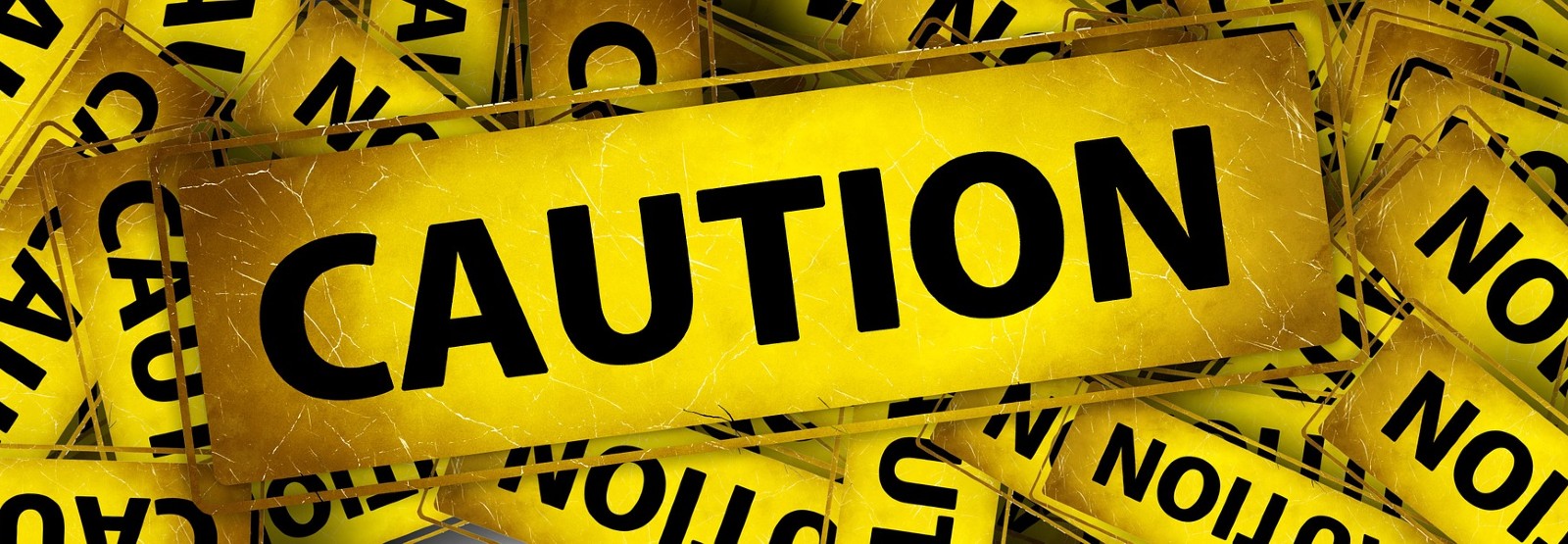 Caution banner on a pile of caution banners